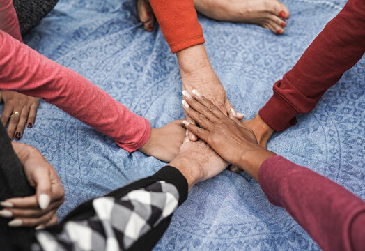 Stacking Hands Of Multiracial Women - Multi Generational People - Team Concept