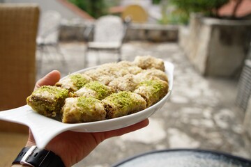 Baklava with pistachios and walnuts. Eastern sweets, Turkish cuisine.