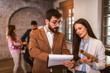 Two designers working together on new project in modern office.