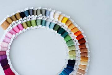 Word DIY world made of colorful bobbins, treads. Do it yourself concept. Sewing, hobby