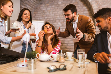 Businesswoman in the office, ignoring work, not listening to annoying clients or bothering colleagues talking to her.