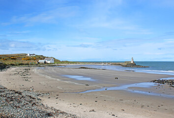 Port Logan harbour beach and lighthouse, Galloway, Scotland	