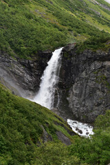 Fototapeta na wymiar Waterfall, montains and gloomy weather