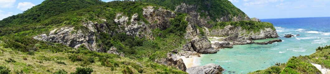 Aerial view of coastal beach and seaside rock from Chishi observation deck in Zamami island, Okinawa, Japan. Panoramic view - 日本 沖縄 座間味島 チシ展望台からの眺望 パノラマ