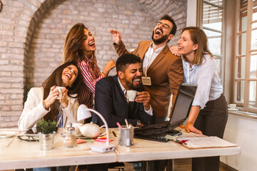 Business project team working together at meeting room at office using laptop.