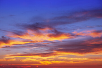 Beautiful evening sky with pink clouds. Sunset over the sea