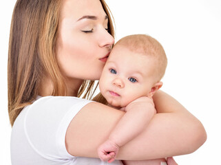 Mother and baby playing and smiling. Happy family.