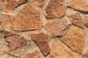Fondo o textura de muro de piedra de color marron