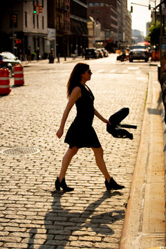 urban scene of a young woman wearing a black outfit 
