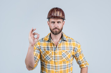 guy wear worker uniform. handsome builder in helmet. mature man wear checkered shirt