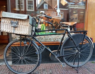 Fototapeta na wymiar Bakfiets (bakers bicycle) in the street of Delft, the Netherlands.