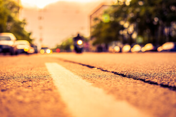 Setting sun in the suburbs, the bike rides along the street. View from the level of the dividing...