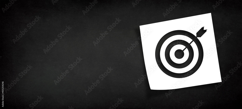 Poster note paper and target sign with copy space on panoramic black background