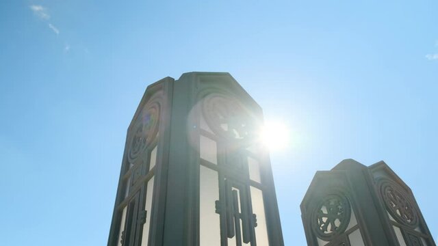 Kubinka, Russia - CIRCA 2021: Close up Orthodox Church or tample in black color with golden domes, sun shine in camera. smooth camera movement, faith in God and Christ. Cathedral in Park Patriot.