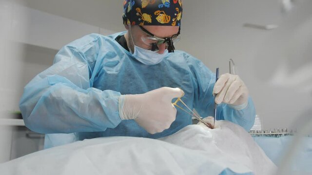 The process of suturing the rata cavity in a dental clinic during surgery.