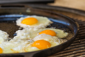 Fried egg on the grill. Close up