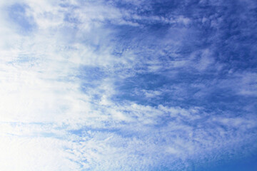 Beautiful blue sky and white cirrocumulus clouds. Background. Texture. Scenery.
