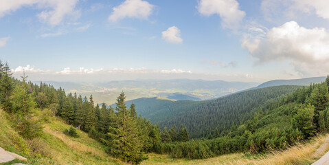 Fototapeta na wymiar Panoramic view from the top of Serak mountain in Jesenik Czech Republic. Autumn mountains at Cottage of Saint George