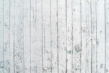 White wooden background. Old shabby wood planks. A stripped white fence. Natural creative texture...