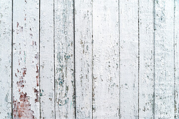 White wooden background. Old shabby wood planks. A tattered white fence. Natural creative texture for editing and design.