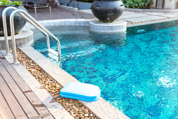 Foam board for the teaching of swimming beside swimming pool