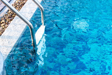 Wave Water in swimming pool. Blue ripped water in pubic swimming pool.