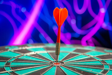 Fototapeta premium Bullseye is a target of business. Dart is an opportunity and Dartboard is the target and goal. So both of that represent a challenge in business marketing as concept. 