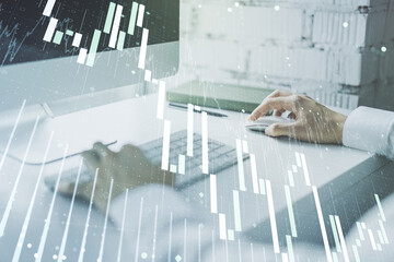 Double exposure of abstract creative financial diagram with hand typing on computer keyboard on background, banking and accounting concept