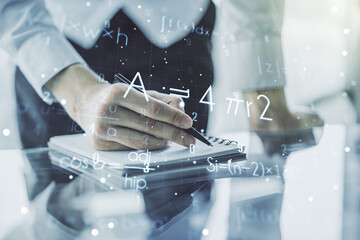 Creative scientific formula illustration with man hand writing in diary on background, science and...