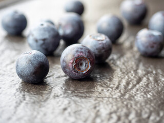juicy ripe blueberries on a textured dark background. Close-up, berries, edaa