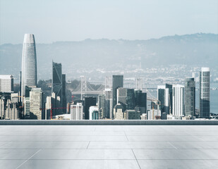 Empty concrete rooftop on the background of a beautiful San Francisco city skyline at sunset, mock...