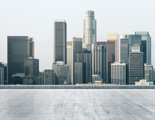 Empty concrete dirty rooftop on the background of a beautiful Los Angeles city skyline at daytime, mock up