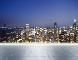 Empty concrete rooftop on the background of a beautiful blurry Chicago city skyline at twilight, mockup