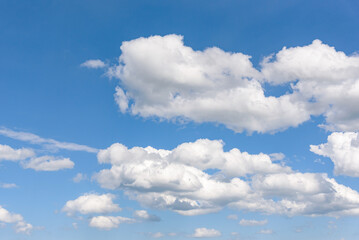 Naklejka na ściany i meble Clouds on the blue sky as natural background