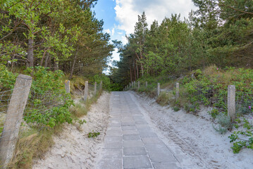 Fototapeta na wymiar Paved beach entrance at Baltic sea in Poland
