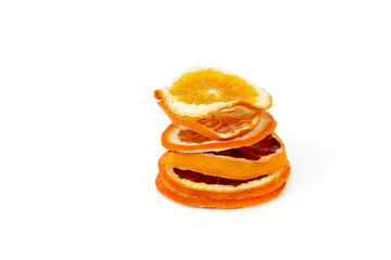 Heap dried orange slices on a white isolated background