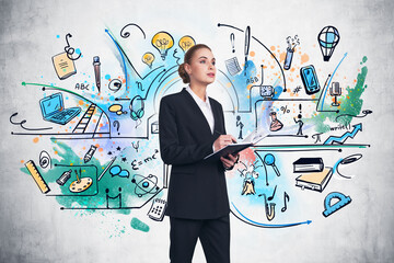 Businesswoman with notebook and diverse business icons sketch on concrete wall