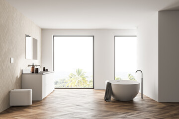 Fototapeta na wymiar Spacious modern bathroom design interior in wood tones with parquet floor, freestanding tub, double sink vanity. Panoramic window.