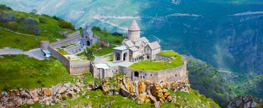 Ancient monastery in setting sun. Tatev. Armenia