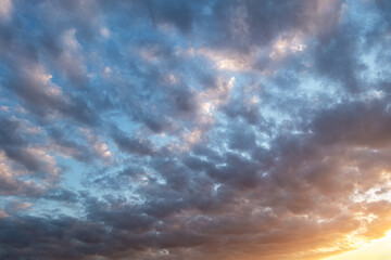 abstract background of cloudy sunset sky golden hour