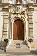 amazing doorway design surrounded by a face with a open mouth used for the entrance to the building in Rome 