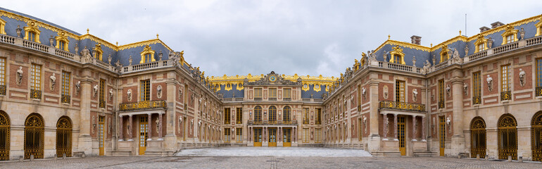 Fototapeta na wymiar Versailles, France - 19 05 2021: Castle of Versailles. View of the facade of the Castle of Versailles from the Honor Square