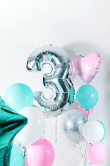Air Balloons Set with number three. Gentle pink white turquoise balloons. Holiday background. Love. Celebration. Birthday baby party decoration. Metallic balloon .