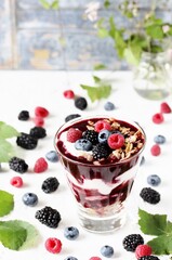 Berry smoothies with yoghurt, granola, chia seeds and fresh berries. Useful breakfast. Berries of blueberries and blackberries, and raspberry. place for a recipe