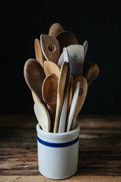 Wood spoons in a ceramic holder 