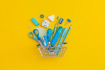 School stationery on a yellow background. Top view with copy space. Flat lay. Back to school concept.