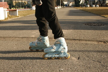 Legs of an unknown person in roller skates