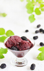 blackberries ice cream Natural homemade  sorbet  and fresh berries of blackberries on a light background.