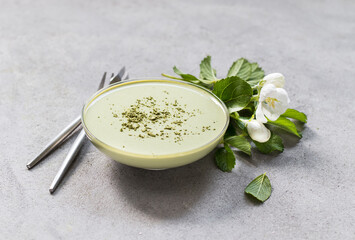Dessert, Creamy green matcha tea jelly in a glass bowl on a light gray background