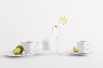 Minimalist white porcelain composition with lemons and avocado